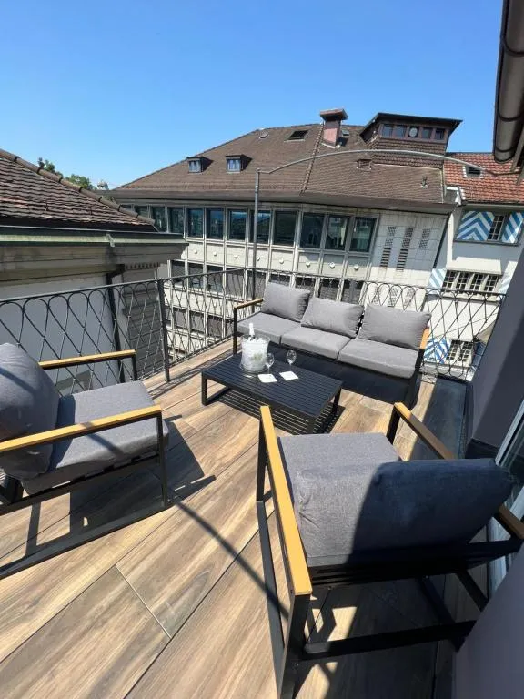 Roof terrace of stattHotel overlooking the rooftops of Zurich's Old Town