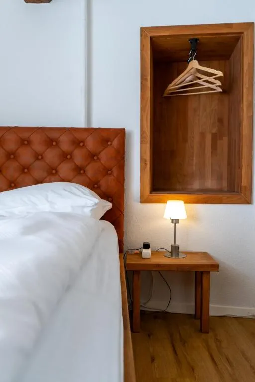 Single room at stattHotel Zurich with single bed and warm lighting