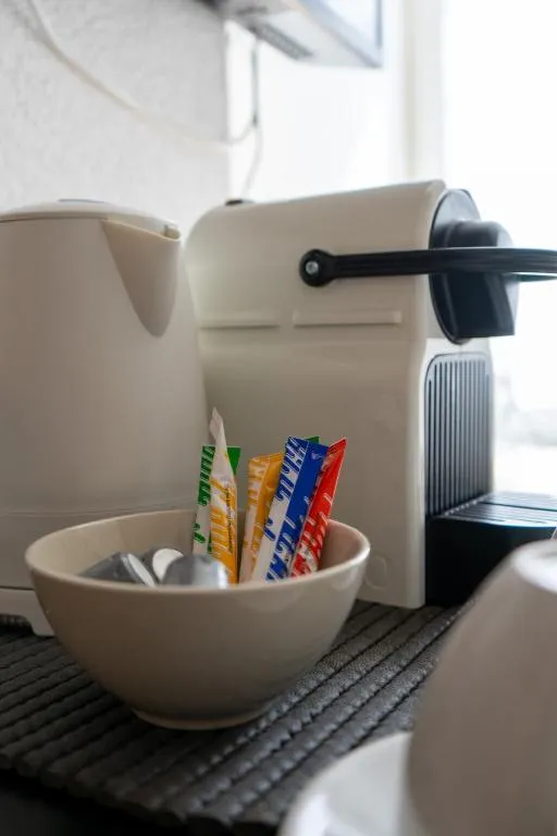 Nespresso machine with cups in a hotel room